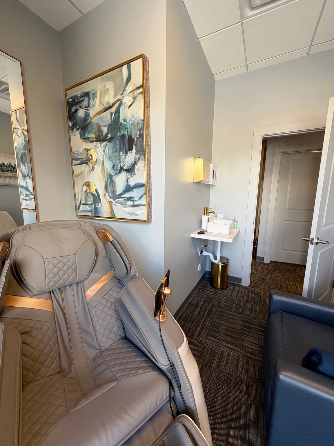 ZuVida relaxation room with a reclining massage chair